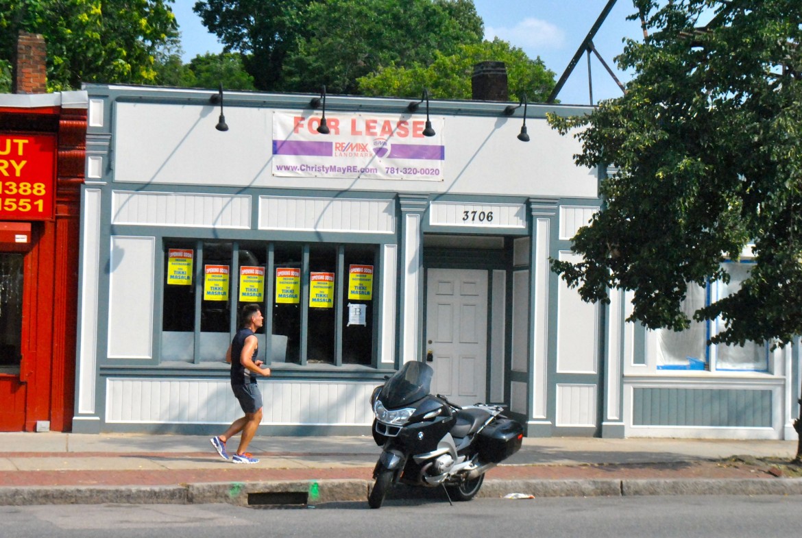 A jogger runs past 3706 Washington St., soon to be home to Tikki Masala Indian Restaurant, on July 25, 2014.