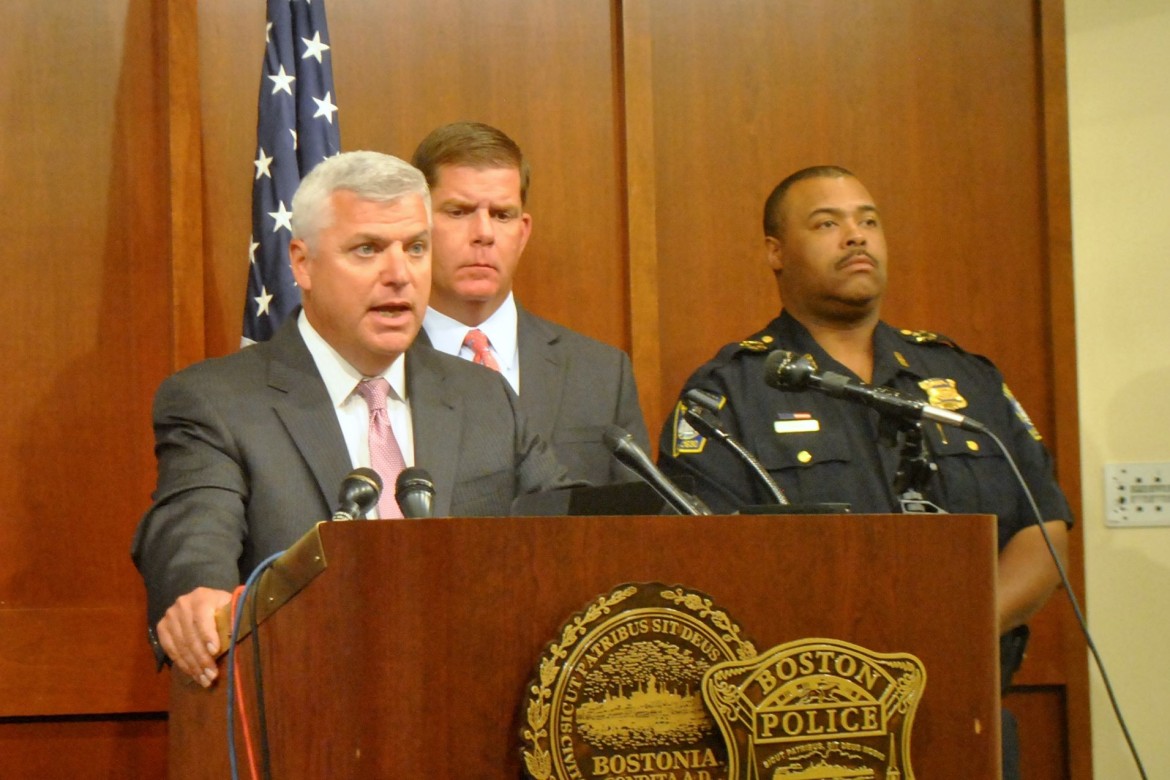 File Photo: Suffolk County District Attorney Dan Conley, left, at an Aug. 25, 2014 press conference at Boston Police Headquarters.