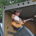 Darren Ray of Love Love rocks out, seconds before losing his hat, at the Jamaica Plain Music Festival, Saturday, Sept. 6, 2014.
