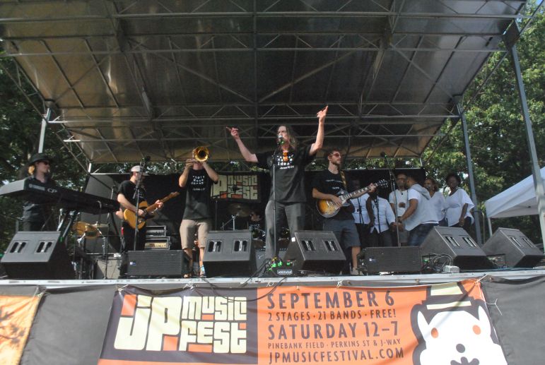 Rick Berlin, center, and the Nickel & Dime Band, accompanied by Praise & Worship Team from Bethel AME Zion Church, at the Jamaica Plain Music Festival, Saturday, Sept. 6, 2014.