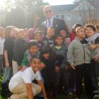 City Councilor Matt O'Malley celebrates with students at the ribbon cutting for the new playing field at Curley K-8 School on Tuesday, Oct. 28, 2014.