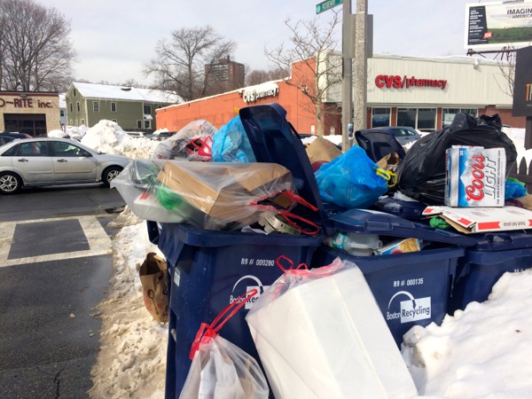 Recycling bins await pickup on Centre Street, Wednesday, Feb. 18, 2015.